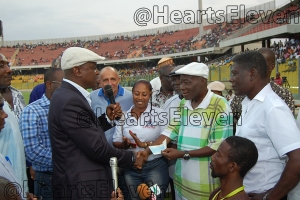 Accra Hearts of Oak Board Chairman, Togbe Afede XIV, presenting a cheque to Cecil Jones Attuquayefio during his testimonial match.